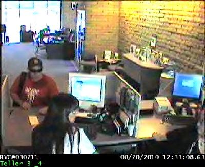 Bank robbery suspect, one of seven images. Call (775) 887-2009 if you recognize this man. Click through other photos.