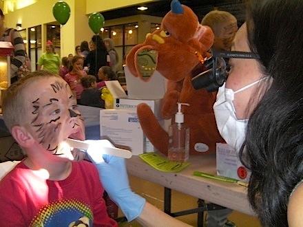 Andrius Stankus, 6, gets his teeth checked by Elizabeth Park, DDS.
