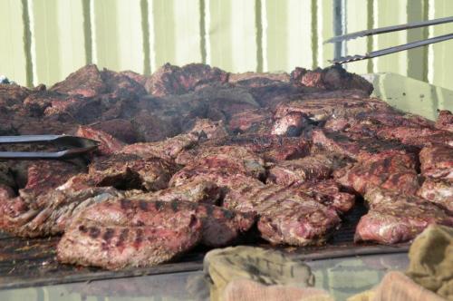 Lots of mouth-watering Tri-Tip roasts on the barbecue.  Photo by Elaine Quilici