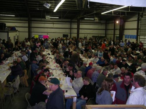 The standing room only crowd waiting for the start of the evening’s raffles and auctions.  Photo by Elaine Quilici