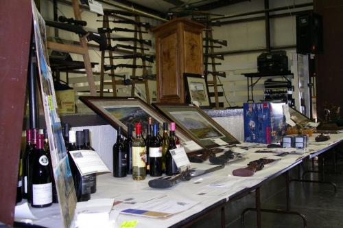 Some of the auctions items on display at the front of the room.  Photo by Elaine Quilici