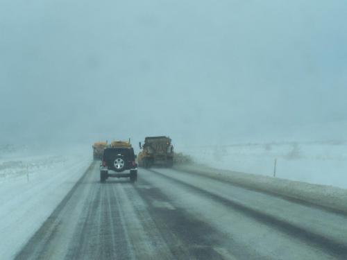 Snow plows in sequence work to clear snow from Highway 395 in the Washoe Valley this morning.  Photo courtesy of NHP