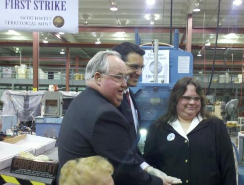 Assemblyman Tom Grady, Gov. Brian Sandoval and Linda Wimberly make the first strike. Photo by Theo McCormick