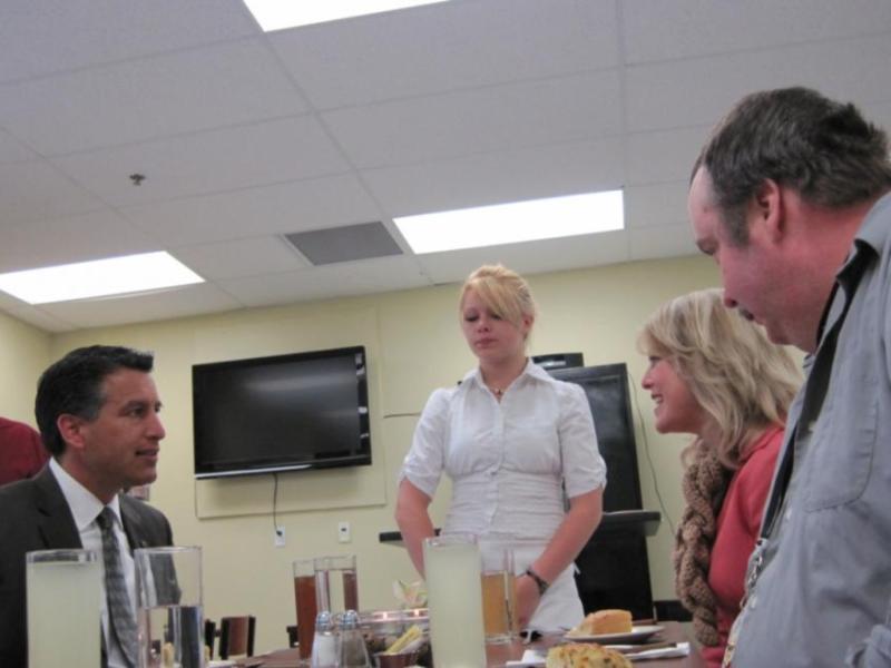 Governor Sandoval chats with community members during a luncheon at Dayton High School's culinary arts class Wednesday.