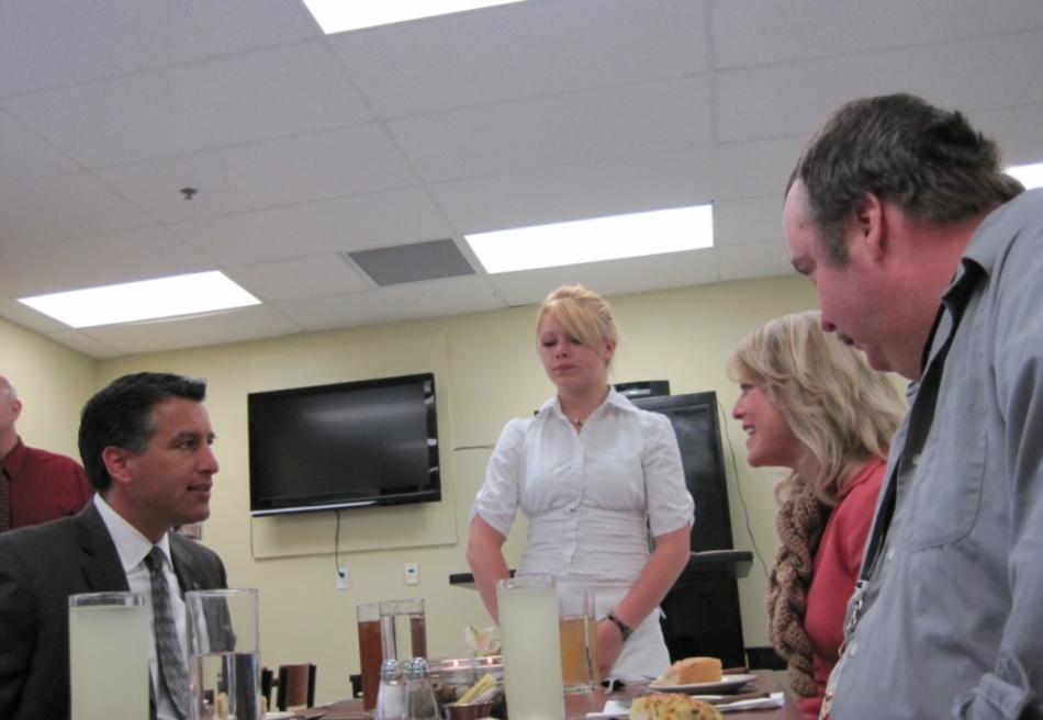 Governor Sandoval chats with community members during a luncheon at Dayton High School's culinary arts class Wednesday.