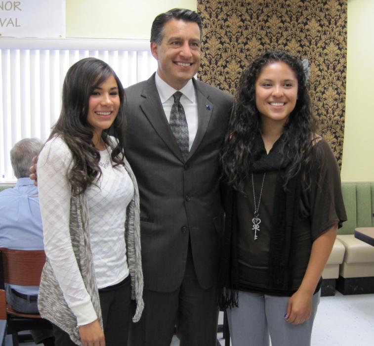 Gov. Sandoval poses with students Erika Garcia and Kathie Arias.