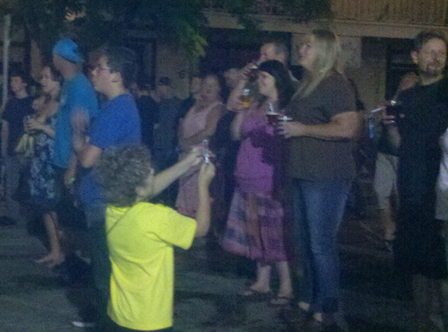 A crowd gathers at Third Street to watch the free show Friday.