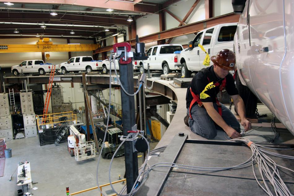 Chad Lyttle adjusts sensor cables for earthquake engineering tests at UNR. Photo by Mike Wolterbeek