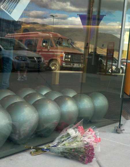A makeshift memorial at the Apple Store at Summit Sierra Thursday afternoon.