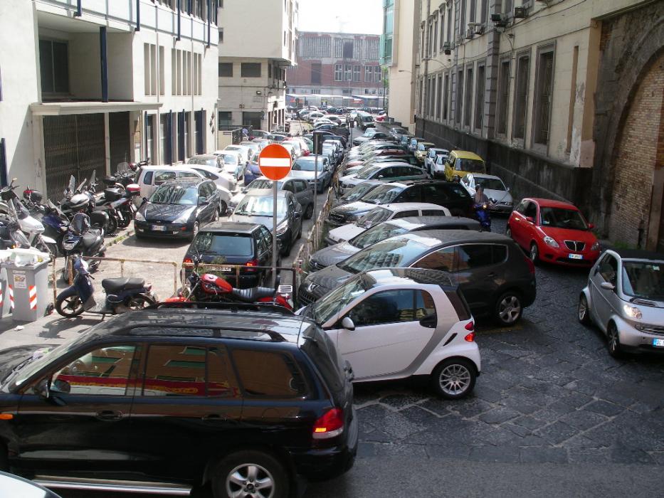 Parking in downtown Rome. It obviously does not pay to be an early parker on this particular street. Photo by Don Quilici
