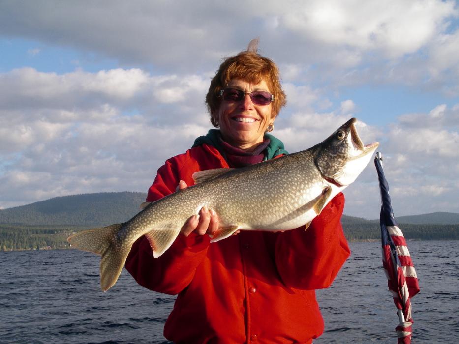 Elaine Quilici with the largest Mackinaw of the day weighing 8.5 pounds and measured 28 inches.  Photo by Don Quilici