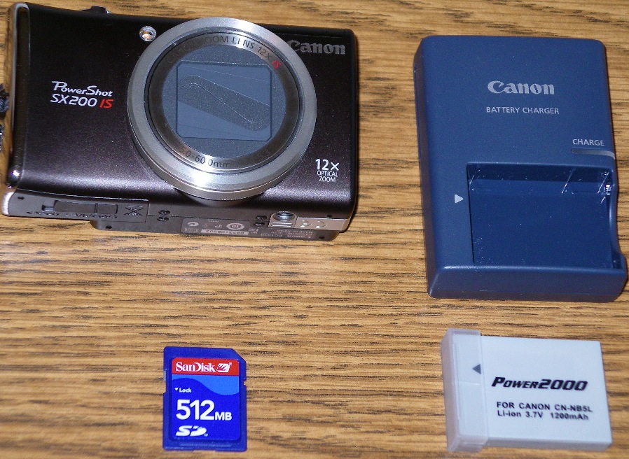 Digital camera with accessories.   Photo by Elaine Quilici