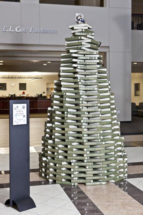 Mathewson-IGT Knowledge Center goes green, erecting a 9.5-foot tree made with books inside the building’s main entrance.