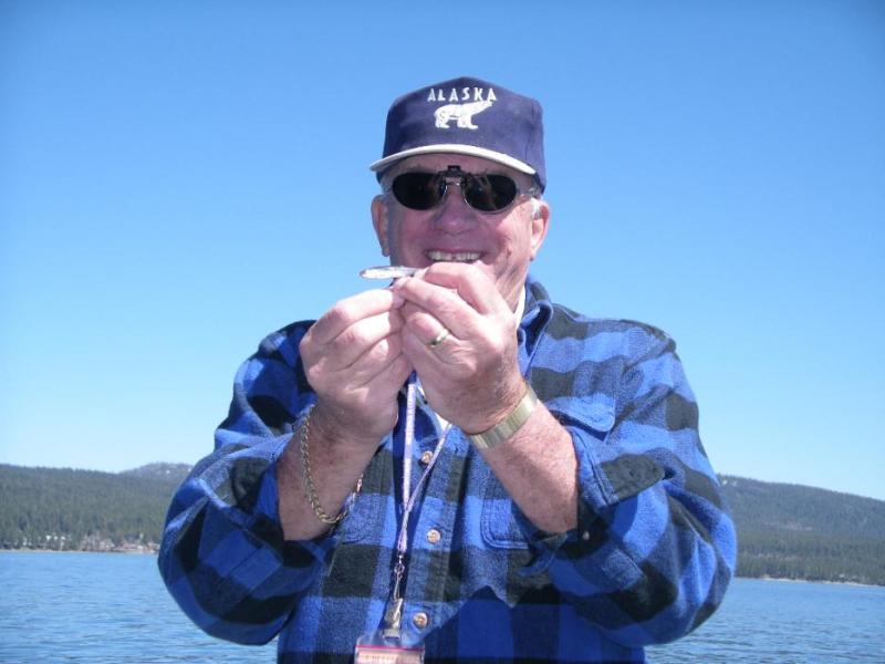 Don Quilici holds a “Possible Keeper, while fishing for Mackinaw (Lake) Trout at Lake Tahoe.  Photo by Elaine Quilici