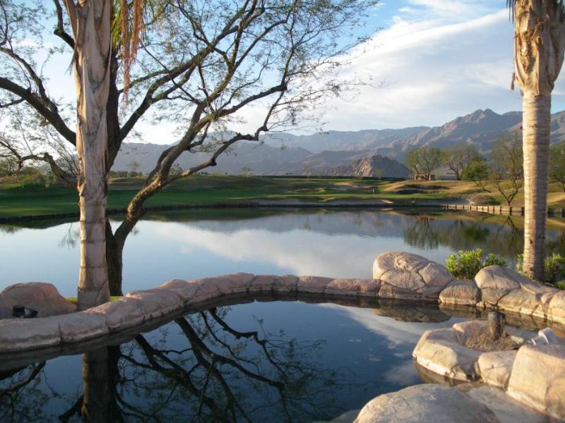 Looking across the swimming pool and the lake to the 9th green of the PGA West – Stadium Golf Course in La Quinta, Calif.