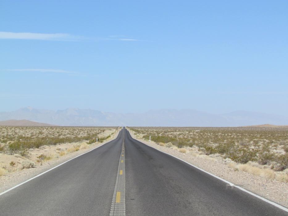 One of many, lonely sections of the highway between Pahrump and Death Valley, California.
