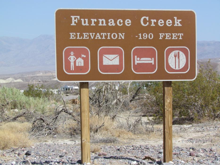 The highway sign at Furnace Creek in Death Valley, indicating an elevation of 190 feet below sea level.