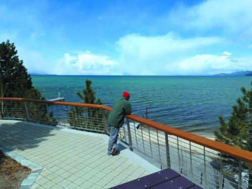 A man takes in the scenery at Lakeview Commons earlier this month. Photo by Taylor Flynn