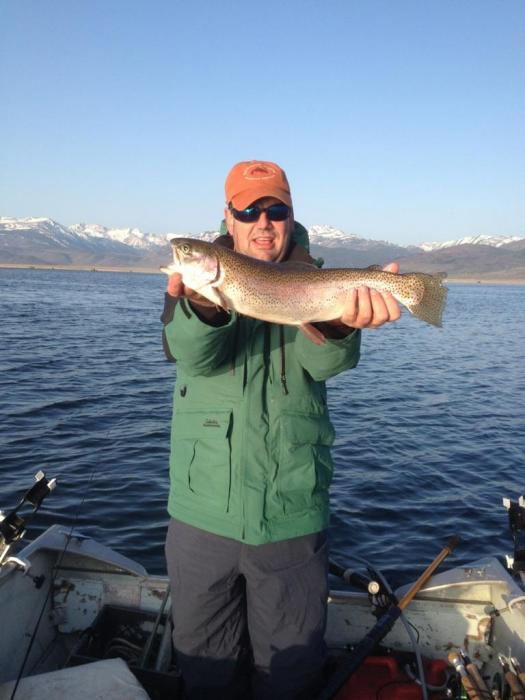 Brent Robinson with a Bridgeport Reservoir rainbow. Photo courtesy of Tom Loe