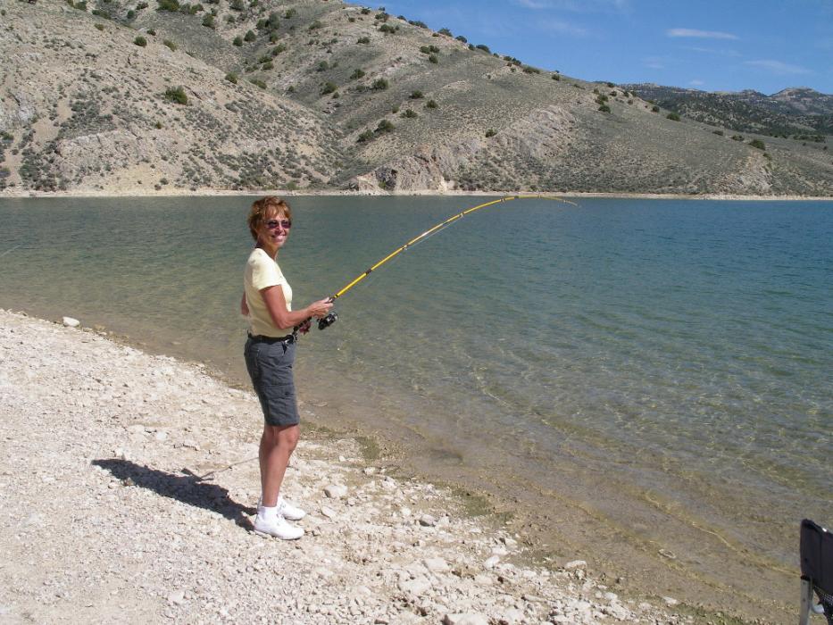 Elaine Quilici reels in a rainbow trout that was caught at Illipah Reservoir in White Pine County. Photo by Don Quilici