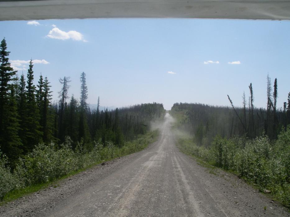 Following a vehicle on the Robert Campbell Highway, between Ross River and Watson Lake in the Yukon. Photo by Elaine Quilici