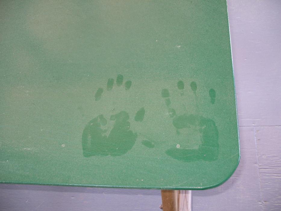 Don Quilici hand prints on the dust of a picnic table at a rest area at Simpson Lake.  Photo by Elaine Quilici