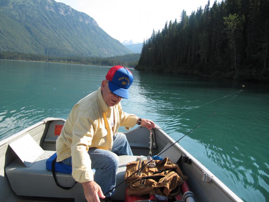 Bob Scholes with one of his “Trophy-Size” rainbow trout.  Photo by Don Quilici