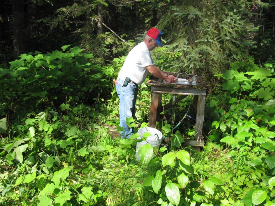 Cleaning fish for the morning’s breakfast for the seven-member fishing party at Mitchell Lake.  Photo by Don Quilici