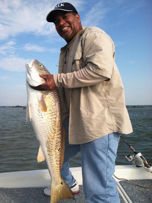 George Parker of Phoenix, Arizona with a 40-pound Bull Red Drum caught Saturday, off the coast at Galveston, Texas.