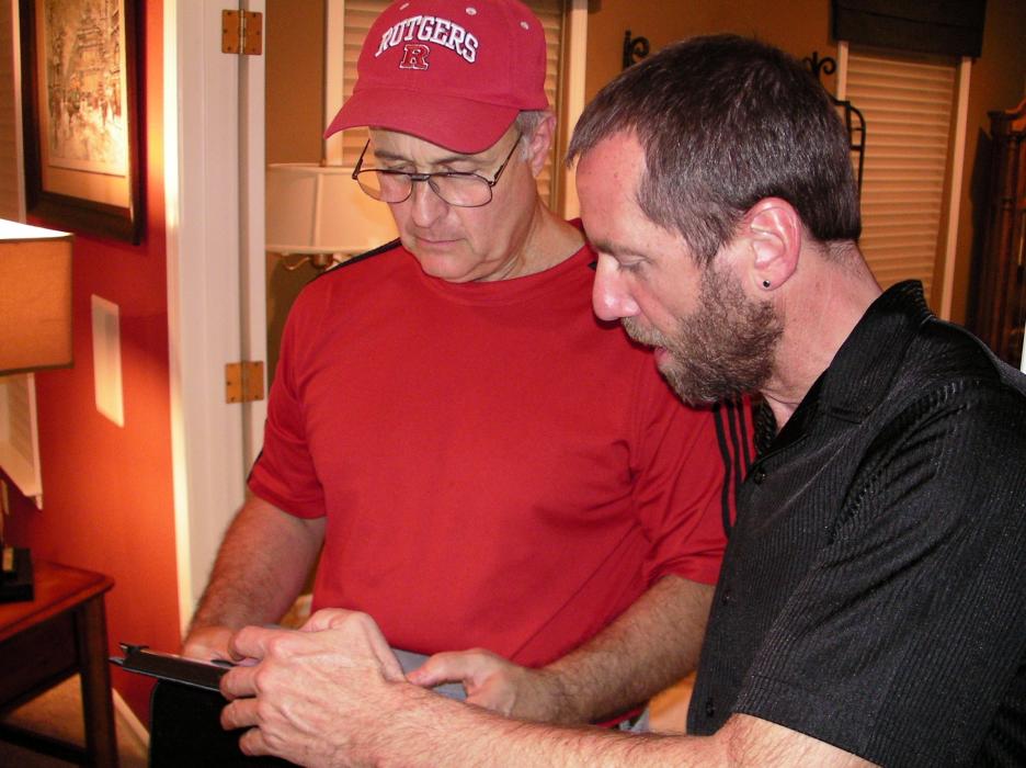 Campaign manager Larry Messina, left, and Brad Bonkowski keep tabs on election results.