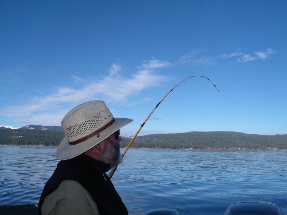 Gene St. Denis carefully watching the tip of a fishing pole. Photo by Don Quilici