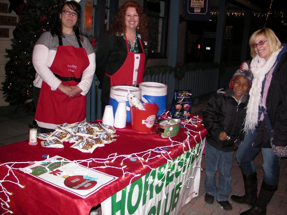 Carson Horseshoe Club's Debi Blake & Dana Lee Fruend serve Erich Parker, 7, and Jayme Porter.