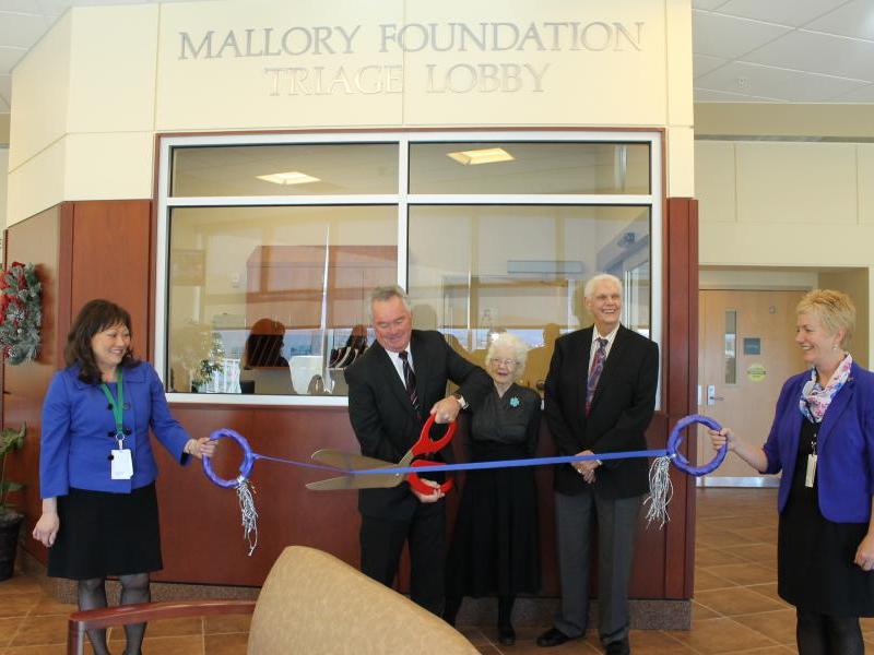 : Mallory Foundation Trustees Riley Beckett, Tom Cook, and Ellen Shock cut the ribbon for the remodeled ER Triage Lobby