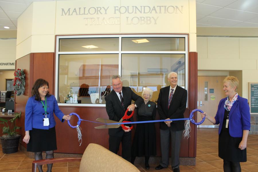 : Mallory Foundation Trustees Riley Beckett, Tom Cook, and Ellen Shock cut the ribbon for the remodeled ER Triage Lobby