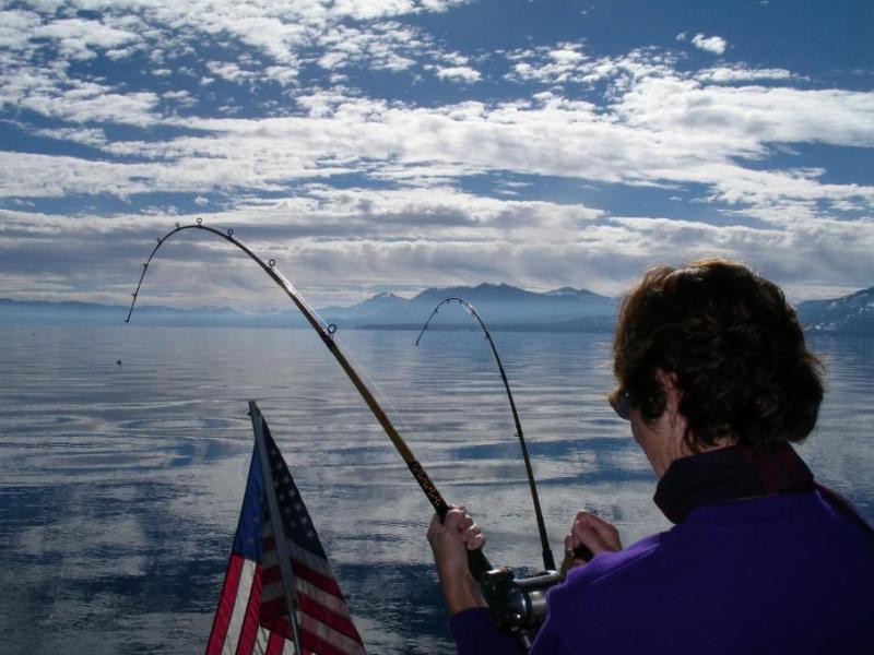 Elaine Quilici of Carson City reeling in her Mackinaw (Lake) trout caught while trolling at Lake Tahoe.  Photo by Don Quilici