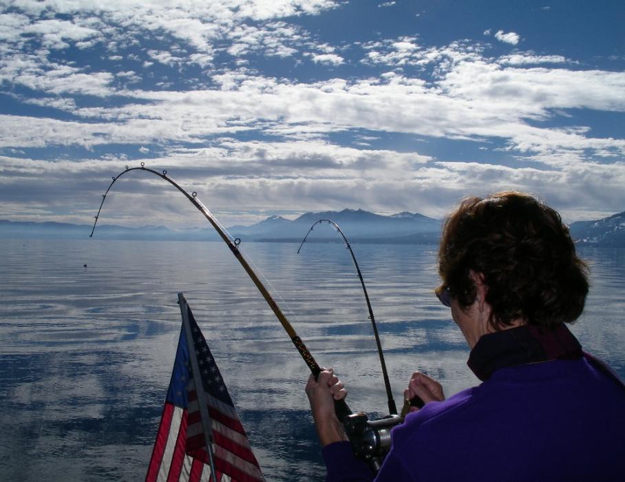 Elaine Quilici of Carson City reeling in her Mackinaw (Lake) trout caught while trolling at Lake Tahoe.  Photo by Don Quilici