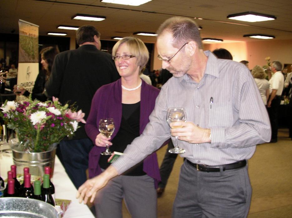Lucy Adams and Michael Bish sample the wine.