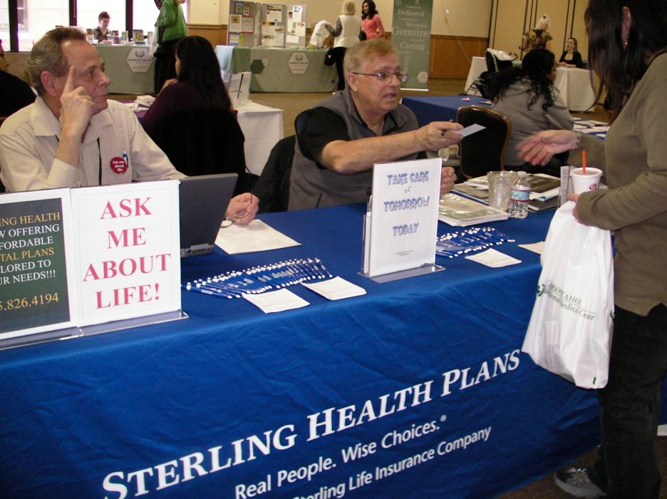 Robert Cooper and Ronald Bliss of Sterling Health Plans speak with Kathy Wynards of Dayton.