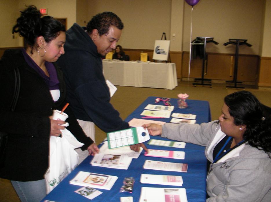 Jenny Ayala and Heyver Ortega speak with Blanca Ayala, outreach coordinator with Nevada Health Centers.