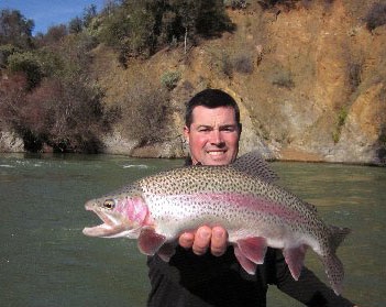 A rainbow trout caught fly fishing the Sacramento River. Photo: Kirk and Lisa Portocarrero of Outdoor Adventures Sport Fishing