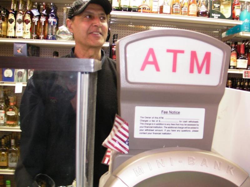 Randy Cheeme, owner of Capital Liquors says he lost business because of phone issues tied to ATM and debit card machines.
