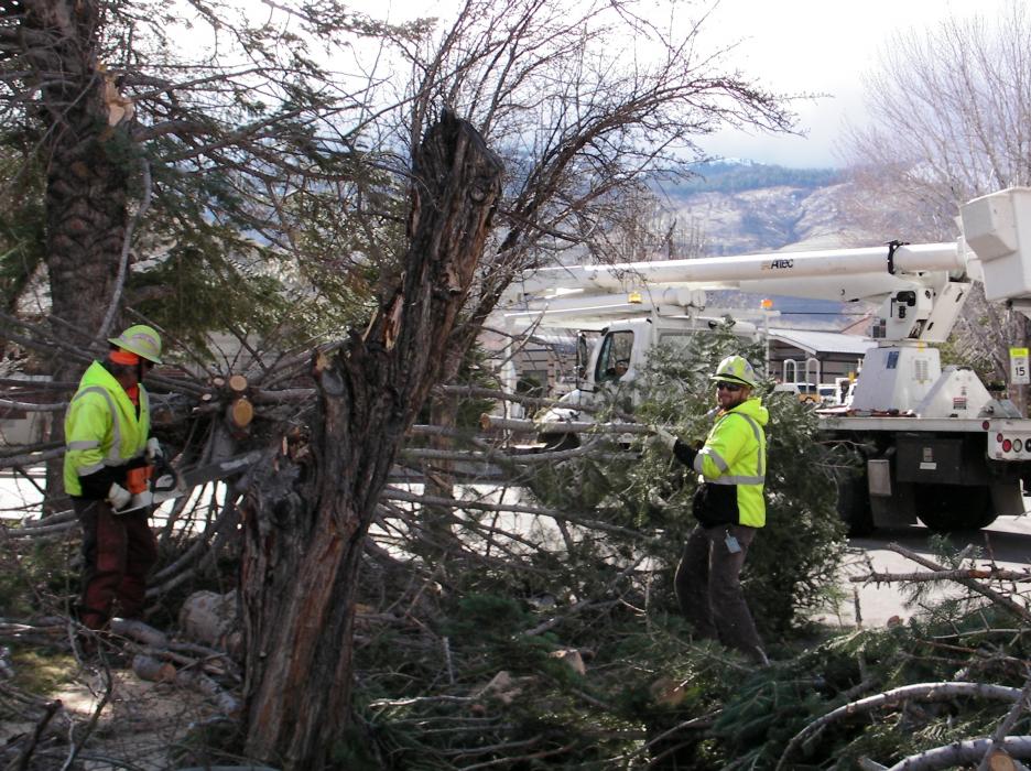 Crews clean debris on Musser Street near the middle school.