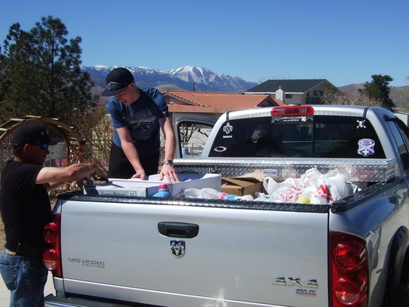 Joe and Dallas Burnett load up a truck of goods to take to Reno.