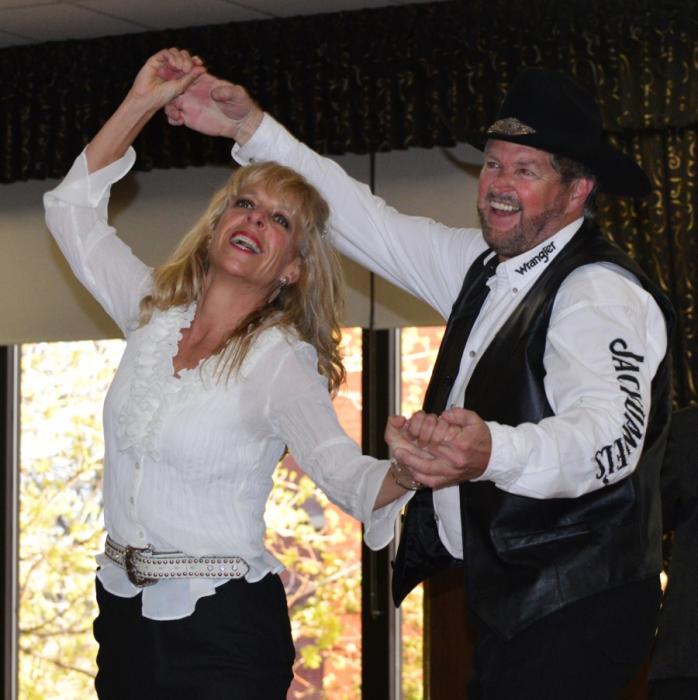 First-place winners Lisa Schuette and Bob Truesdale dance an East Coast swing medley.