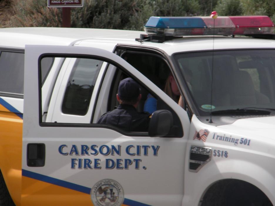 Fire and rescue officials speak with the two aircraft passengers.