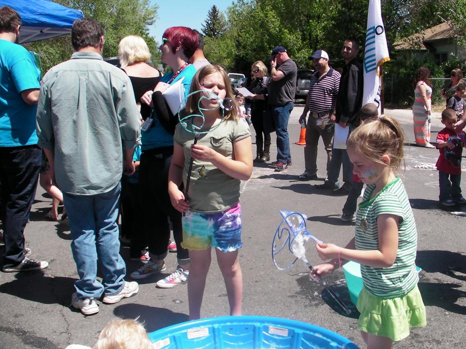 Sisters Jordyn and Emma Deusenberry blow bubbles.
