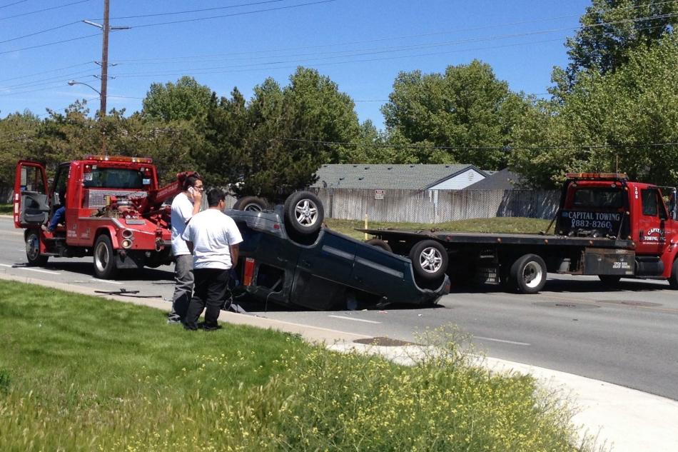 A tow truck prepares to remove the Honda CRV. Photo by Tracy Caraway