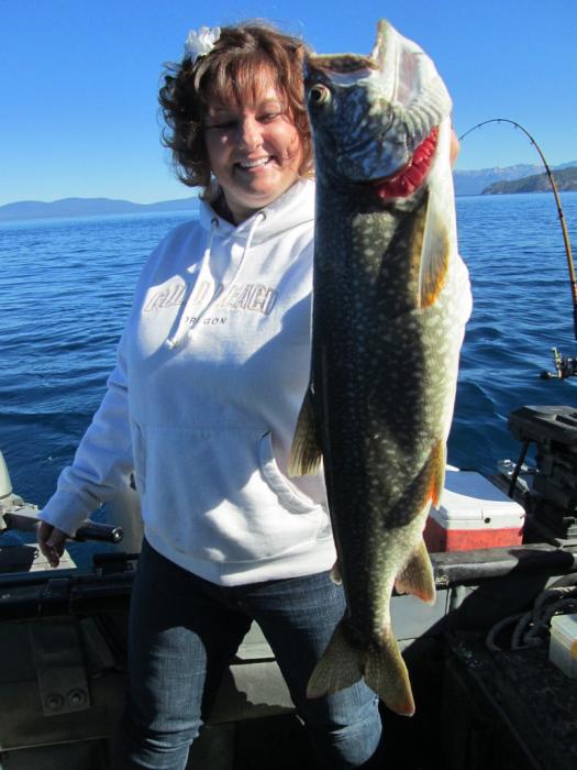 Amber Law of Carson City with her biggest-ever-fish, a Mackinaw Trout caught at Lake Tahoe. Photo courtesy of Gene St. Denis