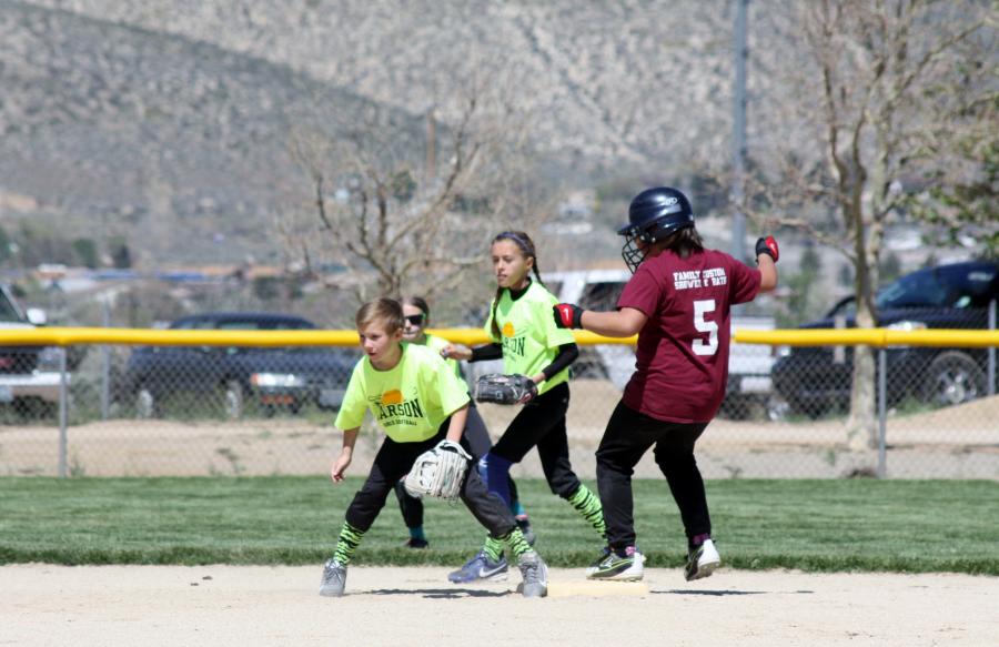Dayton Crazy Devils #5 Ashley Wood is safe at first with Dirt Divas Jocelyn Foster and Abby Golik.
