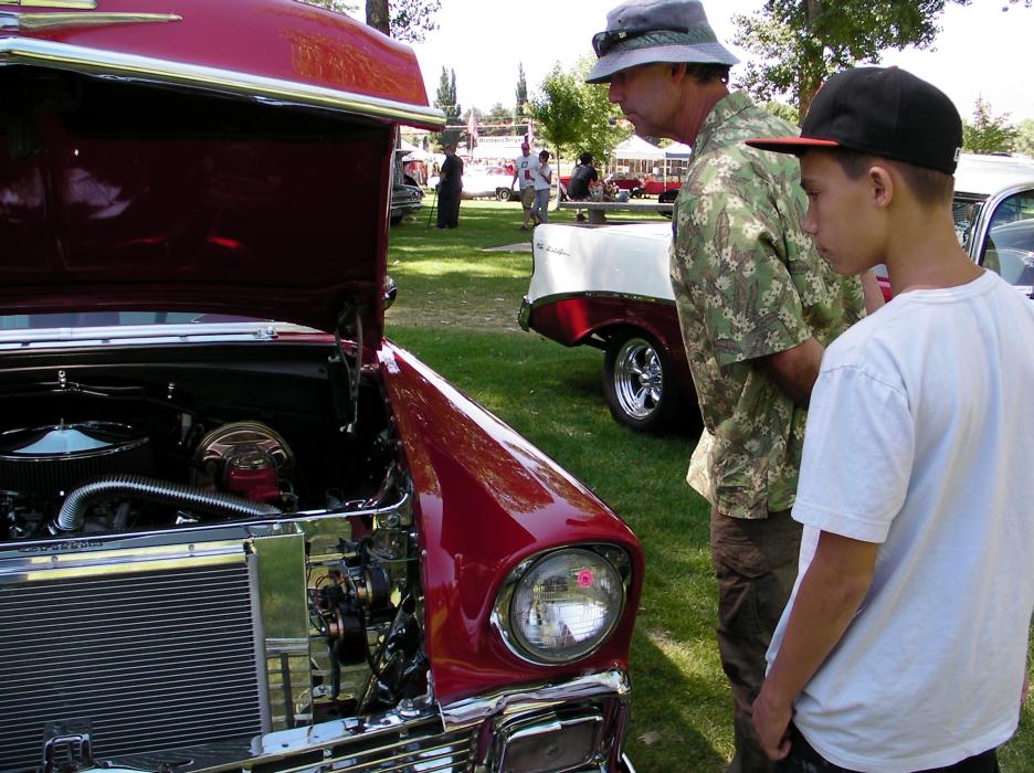 Mark and Luke Deverse of Carson City check out the engine of this classic car.